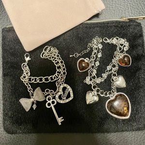 Guess Charm Bracelet + one other. Used and in good condition. Set of 2!